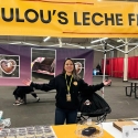 Julianne poses under the banner of her new popup stall