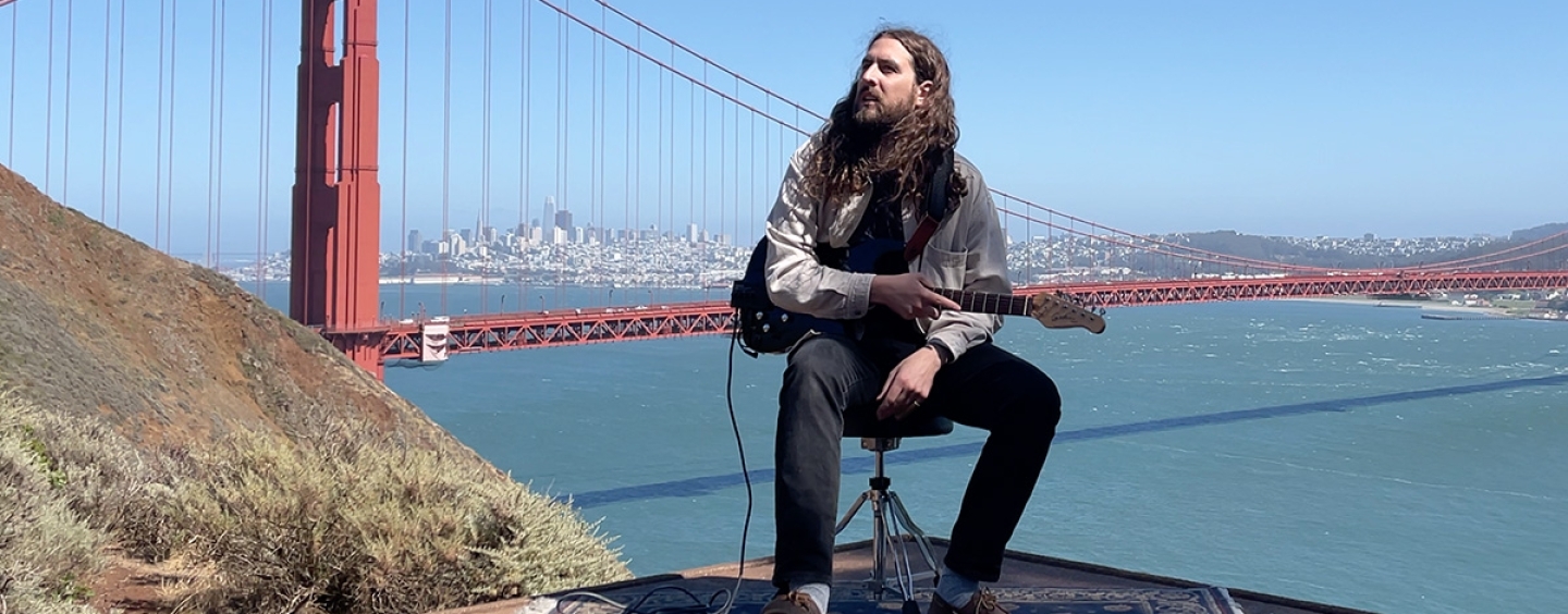 Nate site with a guitair with the Golden Gate Bridge in the background