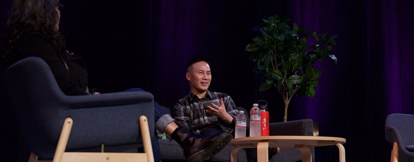 BD Wong sits on a chair 